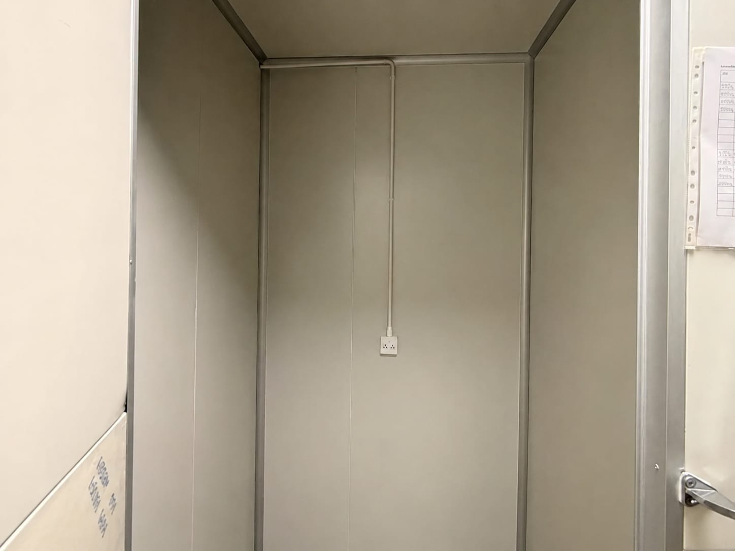 Empty utility closet with power outlet