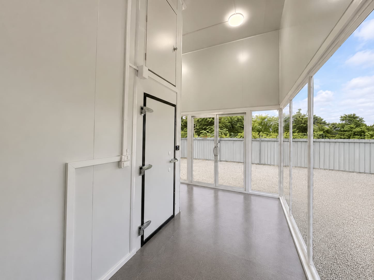 Bright interior hallway with glass doors